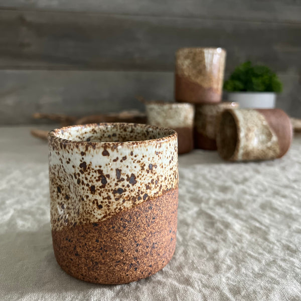 Handmade stoneware pottery. White speckled squish cups.