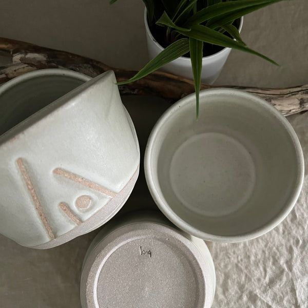 Handmade stoneware pottery. White cereal bowl with lines and dot accents.