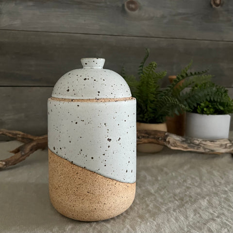 Handmade stoneware pottery. White speckled lidded canister.