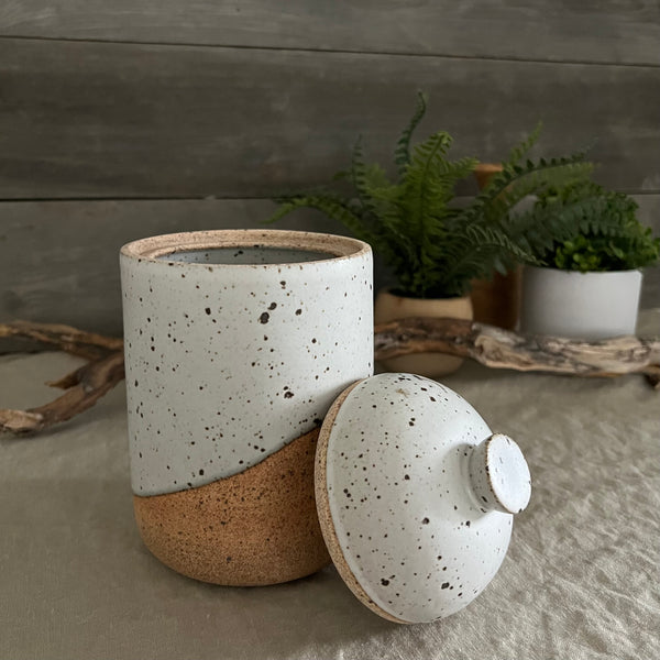 Handmade stoneware pottery. White speckled lidded canister.