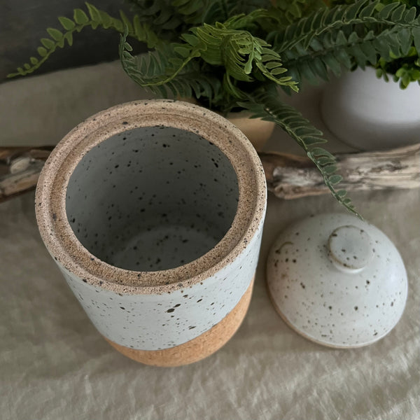 Handmade stoneware pottery. White speckled lidded canister.