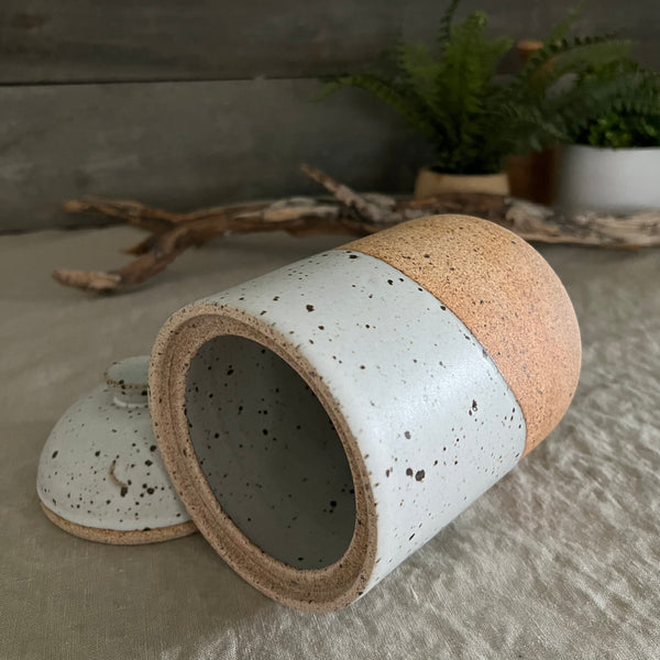 Handmade stoneware pottery. White speckled lidded canister.