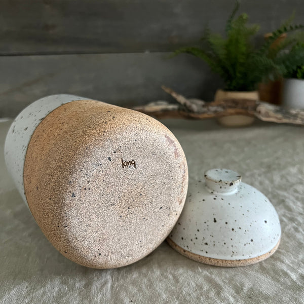 Handmade stoneware pottery. White speckled lidded canister.