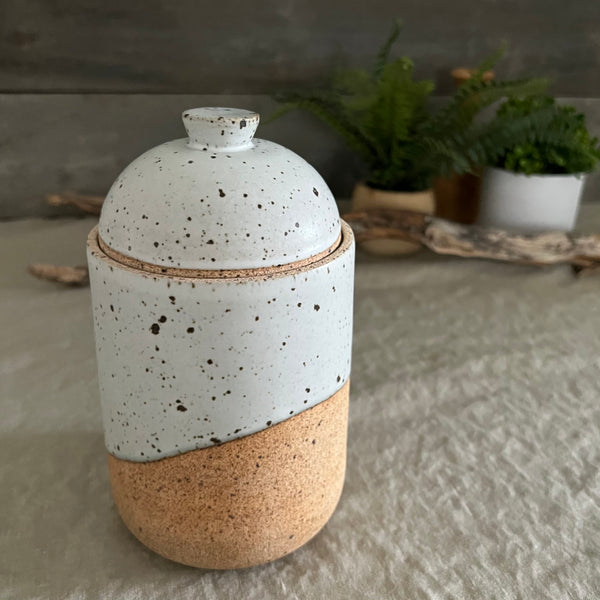 Handmade stoneware pottery. White speckled lidded canister.