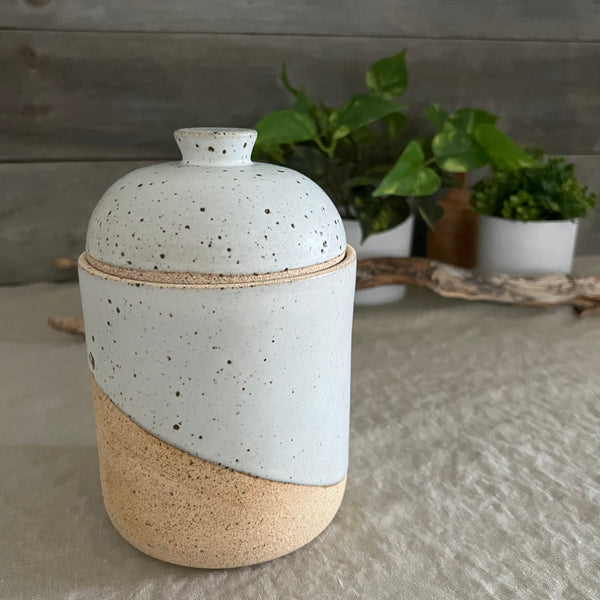 Handmade stoneware pottery. White speckled lidded canister.