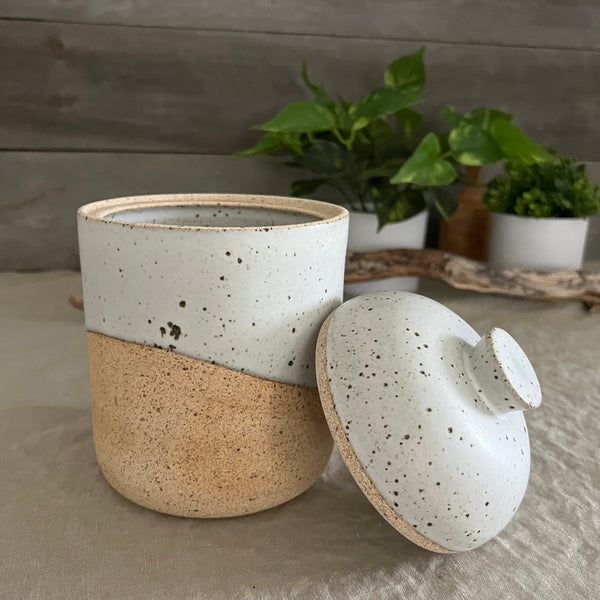 Handmade stoneware pottery. White speckled lidded canister.