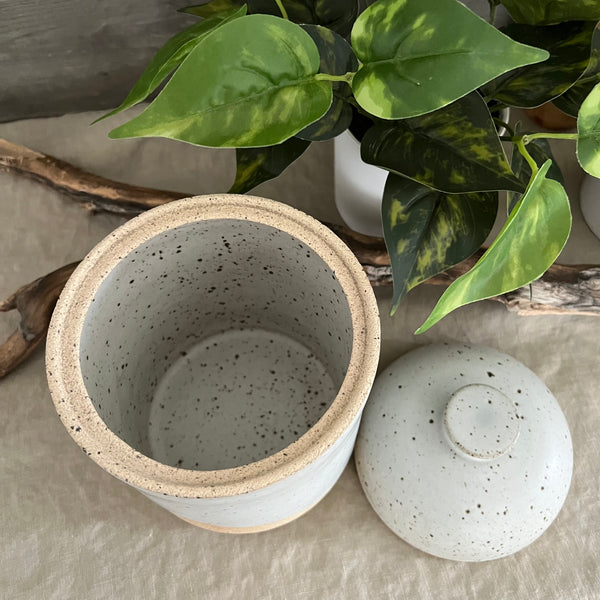 Handmade stoneware pottery. White speckled lidded canister.