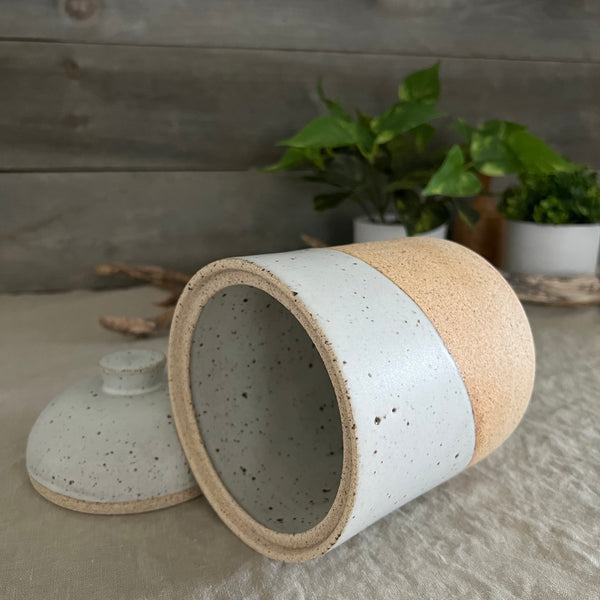 Handmade stoneware pottery. White speckled lidded canister.