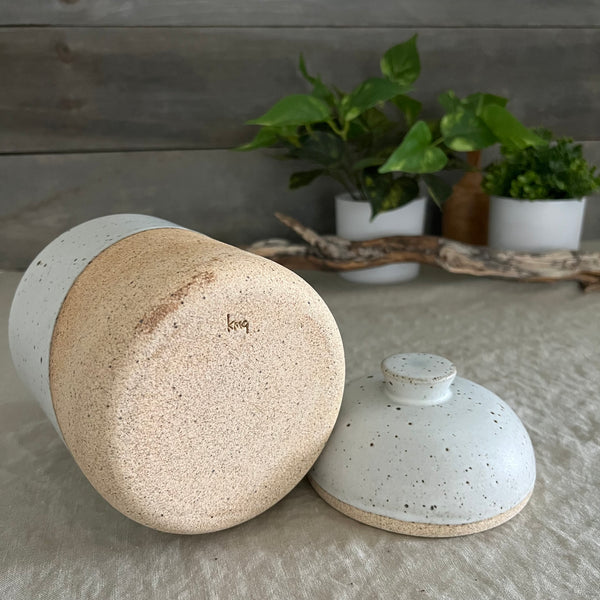 Handmade stoneware pottery. White speckled lidded canister.