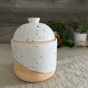 Handmade stoneware pottery. White speckled lidded canister.