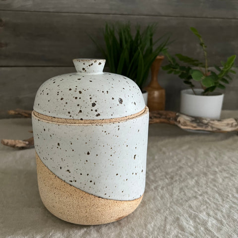 Handmade stoneware pottery. White speckled lidded canister.