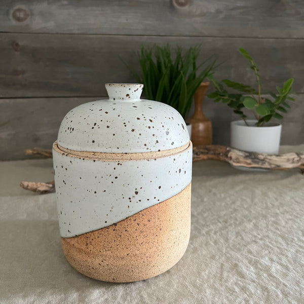 Handmade stoneware pottery. White speckled lidded canister.