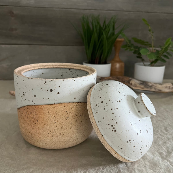 Handmade stoneware pottery. White speckled lidded canister.