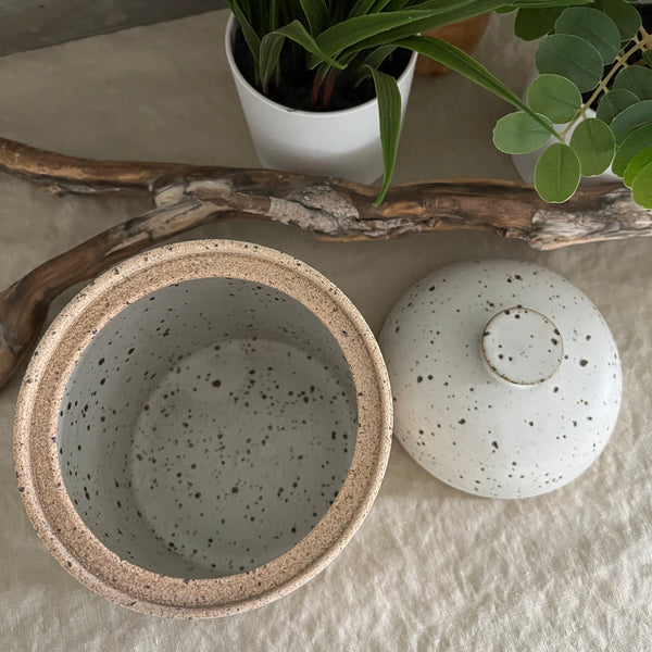 Handmade stoneware pottery. White speckled lidded canister.