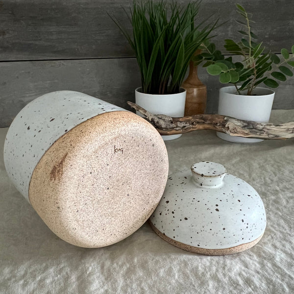 Handmade stoneware pottery. White speckled lidded canister.