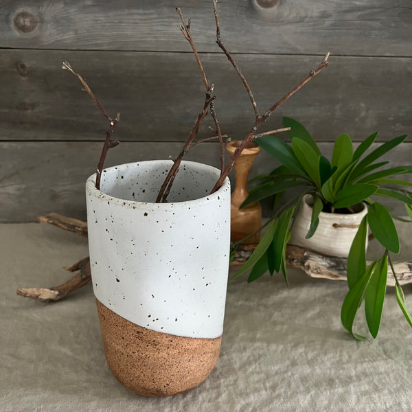 Handmade stoneware pottery. White speckled squish vase.