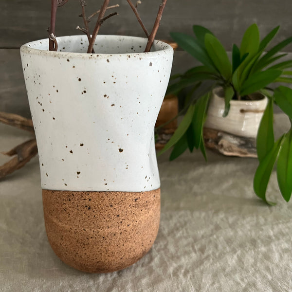 Handmade stoneware pottery. White speckled squish vase.