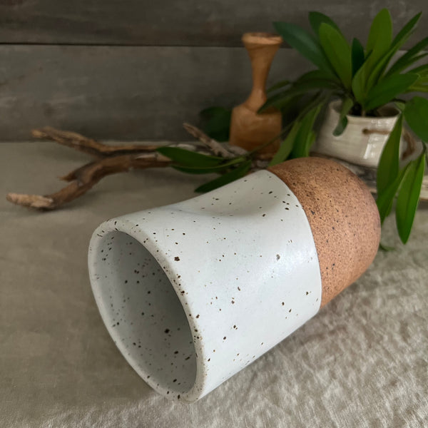 Handmade stoneware pottery. White speckled squish vase.