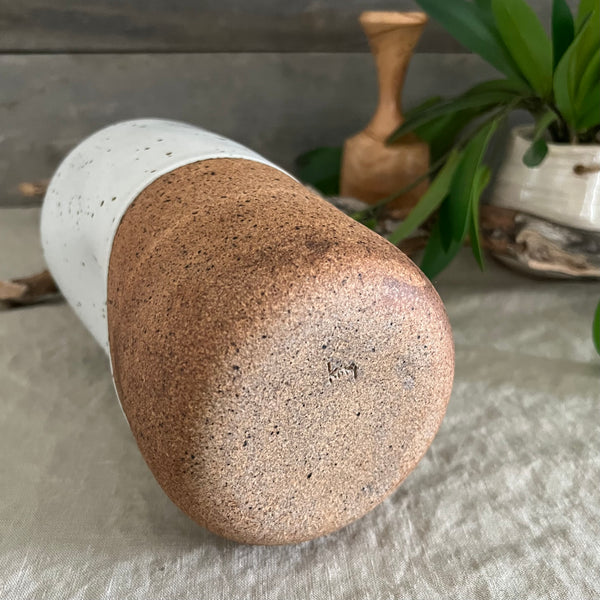 Handmade stoneware pottery. White speckled squish vase.